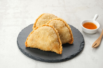 Jalangkote, Indonesian traditional snack filled with egg, carrot, potato, rice noodles. Served with chili sauce
