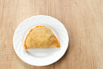Jalangkote, Indonesian traditional snack filled with egg, carrot, potato, rice noodles. Served with chili sauce
