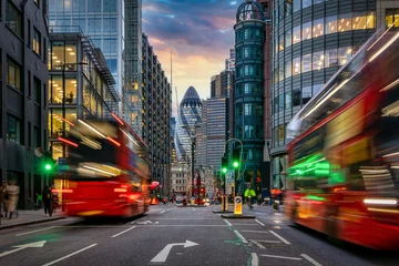 Fotobehang Sunset at the City of London, England, with street traffic light trails and illuminated skyscrapers © moofushi