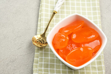 Manisan Kolang-Kaling, or preserved sugar palm fruit with orange color, Indonesian drink and dessert during the month of Ramadan. Selected focus.
