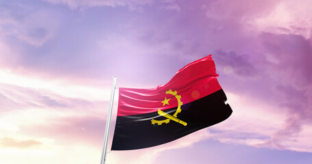 Waving Flag of Angola in Blue Sky. The symbol of the state on wavy cotton fabric.