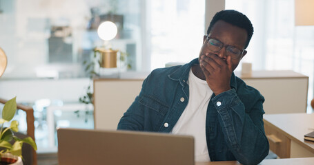 Sleeping, business man and tired web office worker with stress and burnout from project. Digital, black man and fintech agent working on a laptop for finance deadline feeling sleepy from online job