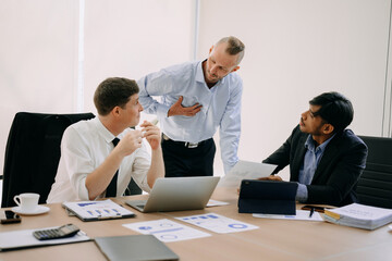Office colleagues have a casual discussion. During a meeting in conference room, a group of business teem sit in the conference room new startup project..