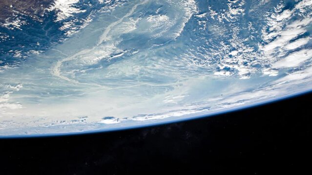Planet earth view from space, upside down rotating clouds and ocean, based on images by Nasa