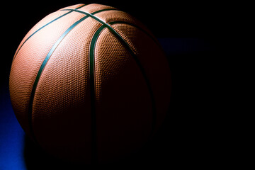 Basketball in Partial Shade on a Blue Surface