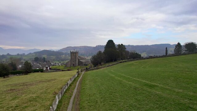 Drone, aerial footage of the historic village of Hawkshead a ancient town in the Lake District, Cumbria. The village is still the same collection of tiny houses, and squares