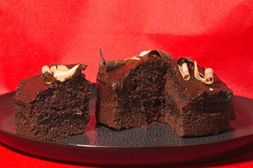 Chocolate Cake on a plate with red background