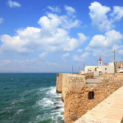 
View on a fortification wall of the Old city of Acre (Akko), Mediterranean Sea and St. John's Church. Israel