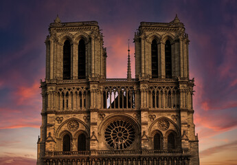 Fototapeta na wymiar Notre Dame against sunset sky. Medieval Catholic Cathedral (Notre-Dame de Paris). European and world architecture heritage. Paris. France