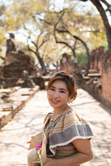 beautiful asian woman smiling with happiness face standing in old temple at ayutthaya heritage site of unesco thailand