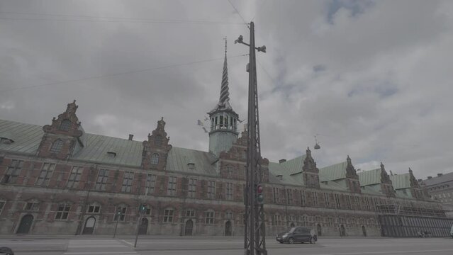 Shot of the Borson building in Copenhagen filmed from below on a cloudy day LOG