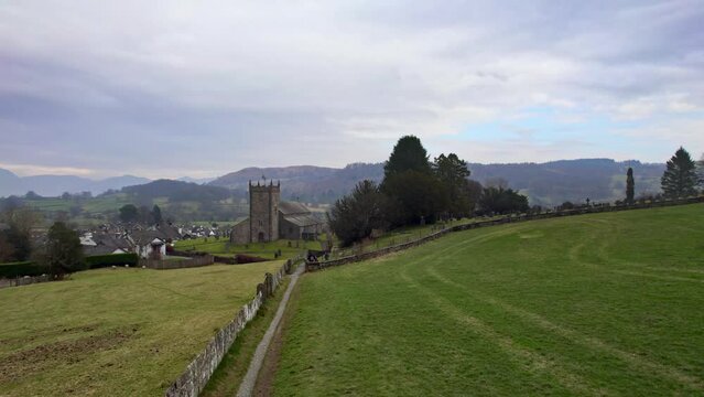 Drone, aerial footage of the historic village of Hawkshead a ancient town in the Lake District, Cumbria. The village is still the same collection of tiny houses, and squares