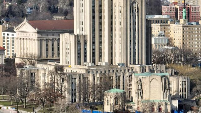 Cathedral of Learning at Pitt. Long aerial zoom rising shot of University of Pittsburgh gothic building.