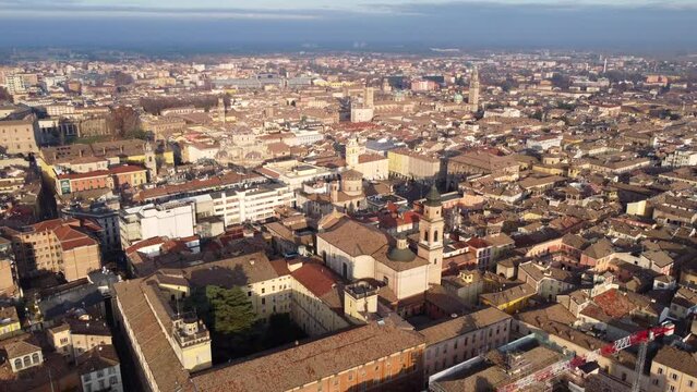 Aerial pullback panoramic cityscape view over Parma, Emilia-Romagna, Italy