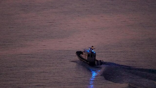 Police boat with lights flashing