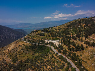 Fototapeta na wymiar Aerial view Pythia Delphi Ancient by drone. Summer Greece. Panorama.