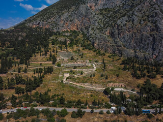 Obraz premium Aerial view Pythia Delphi Ancient by drone. Summer Greece. Panorama.