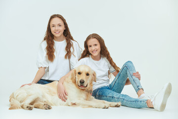 sisters with dog