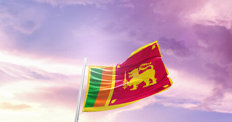 Waving Flag of Sri Lanka in Blue Sky. The symbol of the state on wavy cotton fabric.