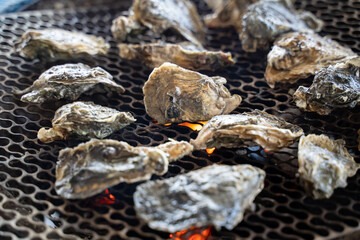 Grilled fresh oyster in Taiwan, famous street food.