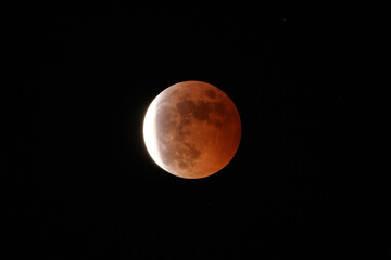 Lunar eclipse on black background.