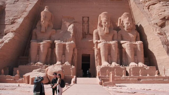 The Great Temple of Ramesses II in Abu Simbel , Egypt with four colossal, 20 m statues, each representing Ramesses II seated on a throne and wearing the double crown of Upper and Lower Egypt.