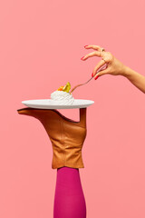 Creativity, art. Delicious dessert, meringue on plate on female legs, boots against pink studio background. Food pop art photography. Complementary colors. Copy space for ad, text - obrazy, fototapety, plakaty