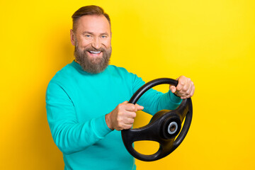 Photo portrait of attractive grandpa hold steering wheel toothy smile drive dressed stylish cyan...