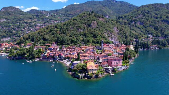 One of the most beautiful lakes of Italy - Lago di Como. aerial drone video of beautiful Varenna village, popular tourist attraction

