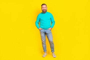 Fototapeta premium Full size photo of attractive grandpa arms pockets garment poster wear trendy aquamarine clothes isolated on yellow color background
