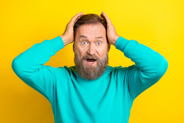 Photo of stressed depressed man wear trendy clothes shocked negative information accident isolated on yellow color background