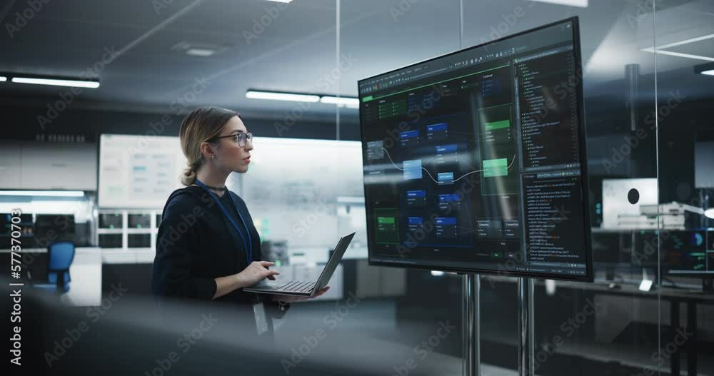 Aufkleber Portrait of a Multiethnic QA Engineer Working on Finding and Fixing Bugs in a Product or Program Software Code Before the Launch. Female Using Laptop Computer, Collaborating with Developers Online