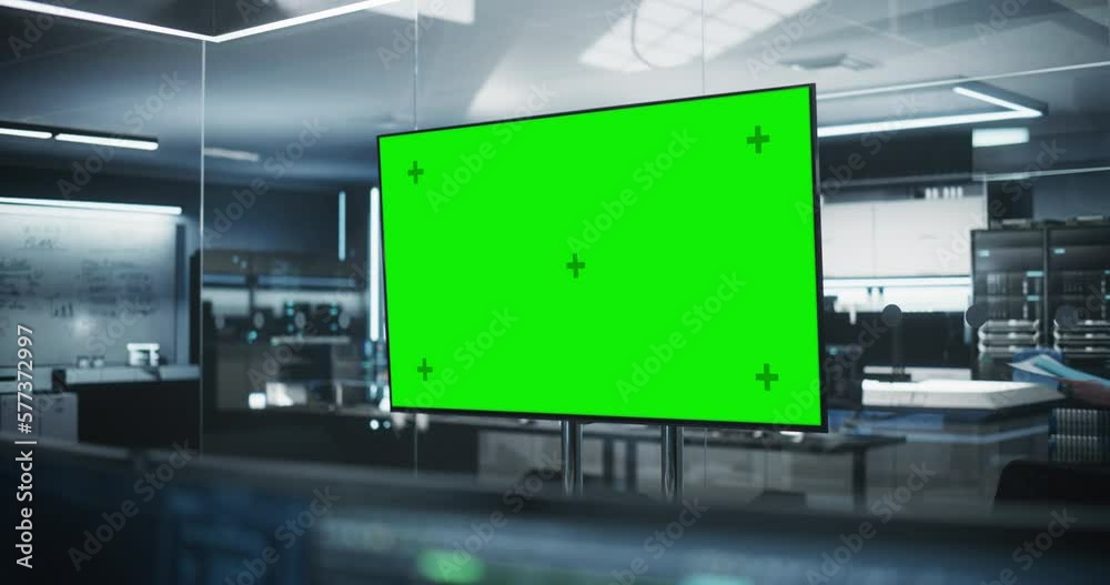Poster Empty Meeting Conference Room with Green Screen Mock Up TV Display. Establishing Shot in a Technologically Advanced Research and Development Office. Manager Walking in the Background