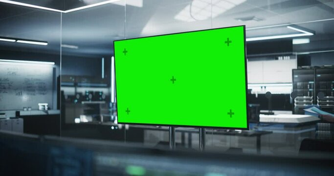Empty Meeting Conference Room with Green Screen Mock Up TV Display. Establishing Shot in a Technologically Advanced Research and Development Office. Manager Walking in the Background