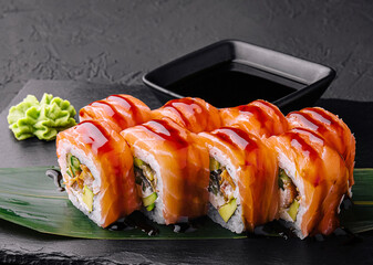 Delicious philadelphia sushi on black stone plate