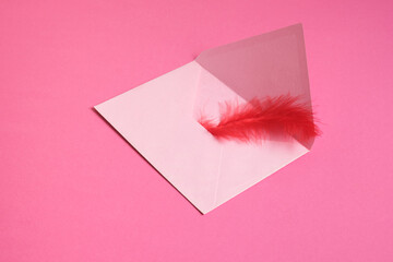 mockup Pink paper envelope on pink background. Flat lay, top view. Romantic love letter for Valentine's day concept.