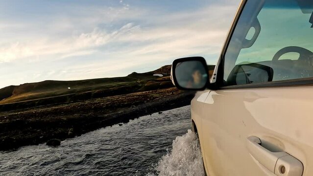 4wd vehicle driving cross the river among remote wilderness in Icelandic Highlands