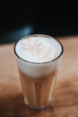 Modern equipment in a coffee shop for preparing coffee drinks - a man brews a cappuccino