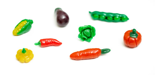 Colorful plasticine vegetable isolated on white background. Creative Handmade vegetables.