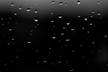 Water drops closeup, black background