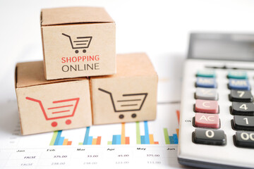 Online shopping, Shopping cart box on calculator, import export, finance commerce.