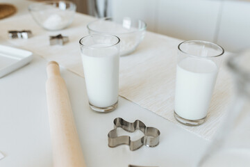 milk in a glass on a white table