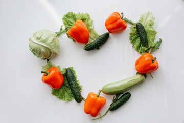 vegetables on the table in the shape of a heart