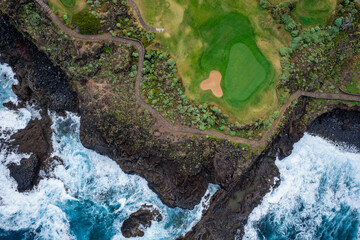 Clouds roll in over golf course on the Atlantic Ocean in Tenerife