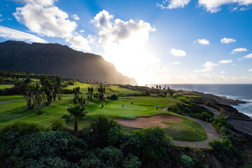Beautiful aerial view of gold course at sunset on the coast of the Ocean, Buena Vista , Tenerife, Canary Islands - obrazy, fototapety, plakaty