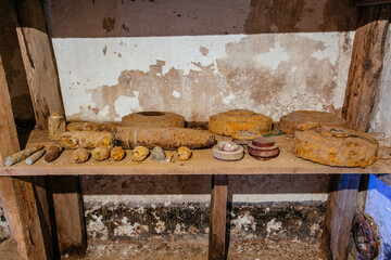 Old rusty ammo, tank shells, mines and grenades, dug out after demining