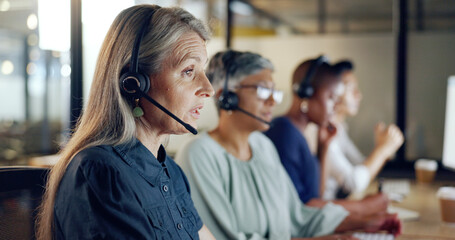 Call center, customer support and telemarketing with a senior woman at work as a consultant in her...