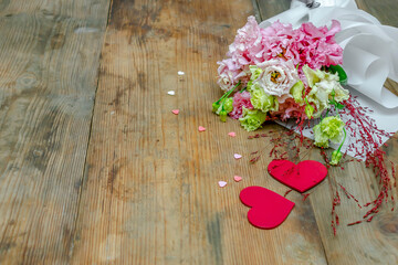 flowers bouquet on wooden table background with copy space. gift to woman on March 8 holiday,...