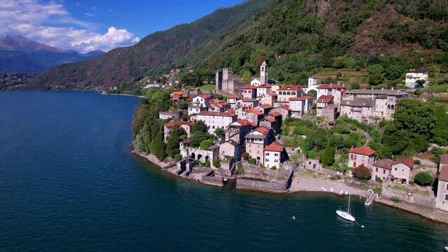 One of the most beautiful lakes of Italy - Lago di Como scenery. aerial drone video of beautiful medieval village Dervio
