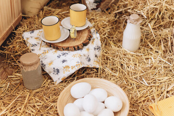 Easter card, eggs and milk on hay
